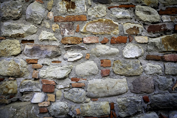 Concrete wall with stones. Color photo