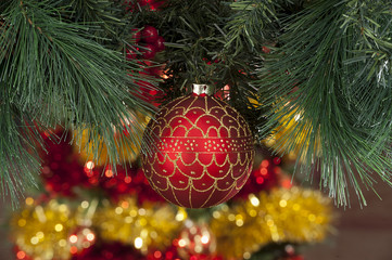 Closeup of red Christmas balls on colored background