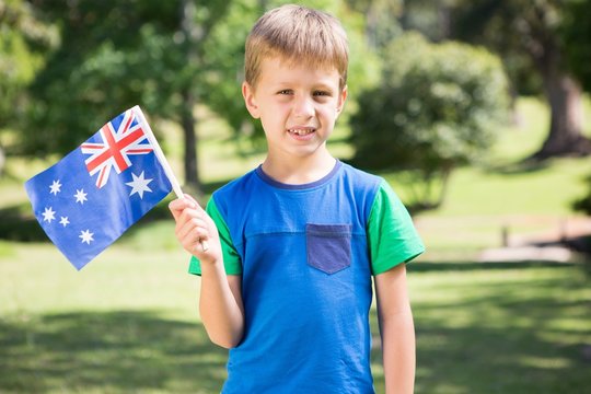 Little boy waving australian flag
