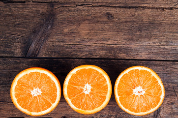 Fresh oranges on wooden background
