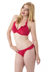 Obraz premium Attractive Young Woman Wearing a Red Polka Dot Bikini