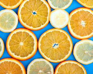 orange and lemon slice on a blue background