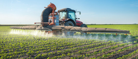tractor spraying pesticides
