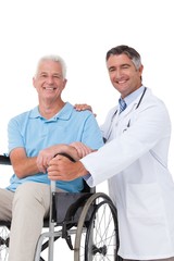 Fototapeta na wymiar Doctor with senior patient in wheelchair
