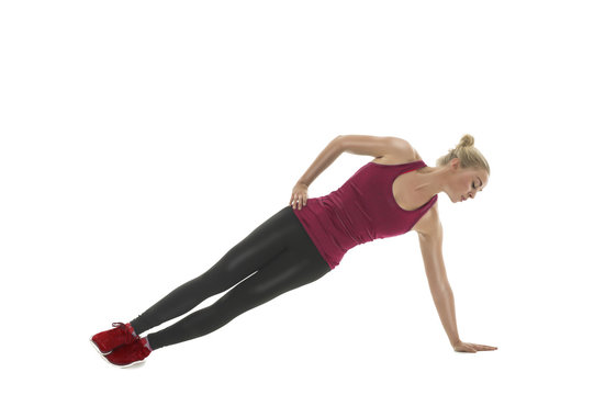 Fit athletic woman working out in a gym