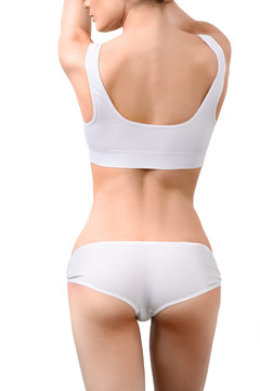 Woman with perfect slim body in white underwear isolated on
