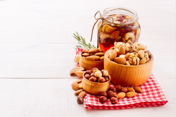 Hazelnuts, filbert on old wooden background