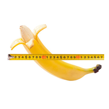 Large banana and measuring tape as image of man's penis