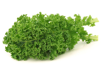 freshly harvested  kale cabbage stems on a white background