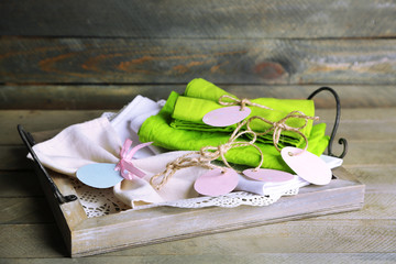 Napkin with Easter decorations  on wooden background