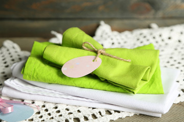 Napkins with Easter decorations  on wooden background