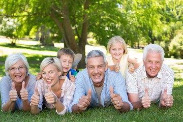 Happy family with thumbs up