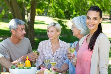 Happy family having picnic in the park