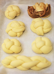 Various raw and baked brioches on plate