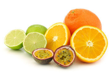 minneola, cut orange, cut lime fruit and cut passion fruit 