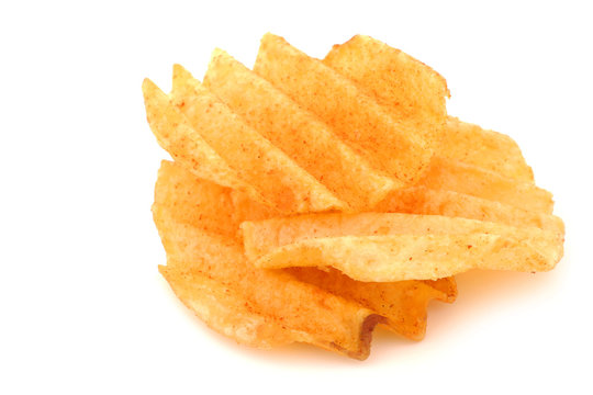 freshly baked deep ridged potato chips on a white background