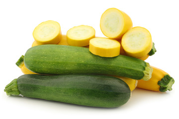 cut yellow and a green zucchini  on a white background