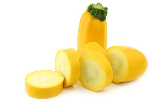 cut yellow zucchini on a white background