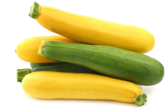 mixed yellow and green zucchini's on a white background