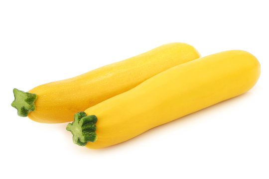 two yellow zucchini's on a white background