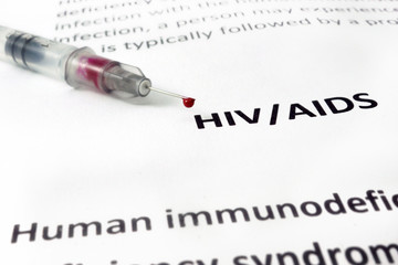 Paper with Hiv aids and syringe  with blood