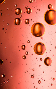 Metallic red oil and water abstract