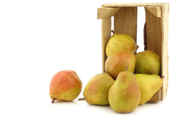 fresh "doyenne de comice" pears in a wooden crate