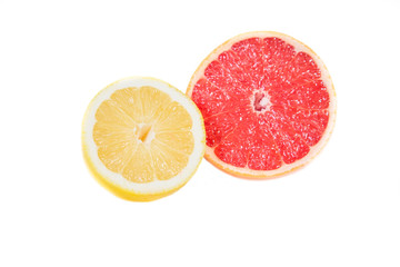 Fototapeta na wymiar Grapefruit and lemon in a cut on a white background