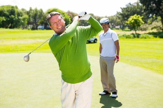 Golfing Friends Teeing Off