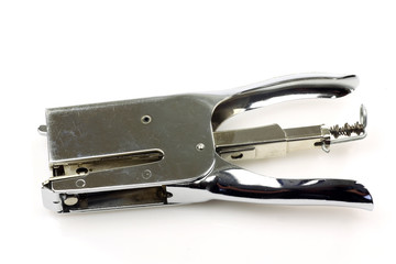 Vintage metal stapler on a white background