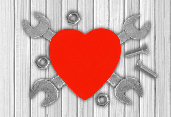 Heart and tools over wooden background. Concept: Renovation of h