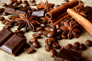 Fototapeta na wymiar Aromatic assortment of chocolate,coffee,anise and cinnamon on li