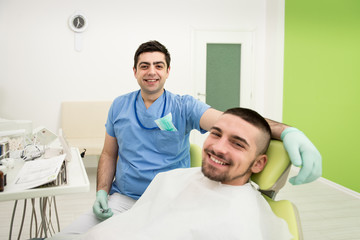Portrait Of A Dentist With Patient