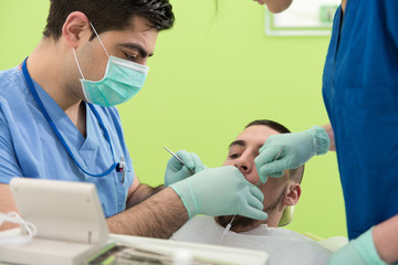 Obraz na płótnie Canvas Young Male Having His Teeth Dental Care