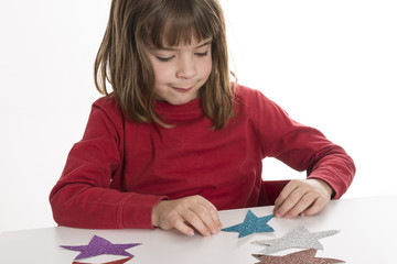 Little girl playing with stars