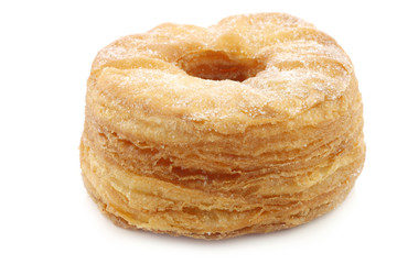 sugared puff pastry donut on a white background
