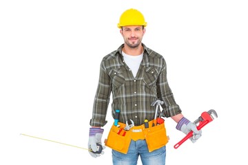 Manual worker holding various tools