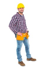 Confident handyman standing with hands on hips