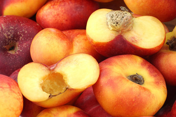 flat nectarines and a cut one background