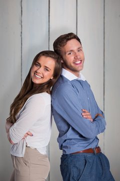 Composite image of portrait of happy couple back to back