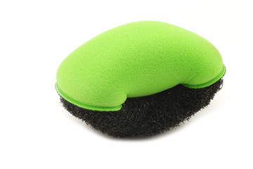 green plastic and foam abrasive pad on a white background