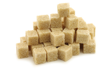 sugar cane cubes on a white background