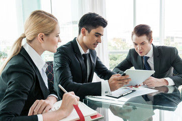 business partners discussing documents and ideas at meeting