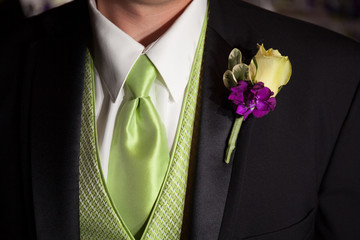 white purple green wedding flower boutinerre