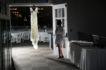 wedding dress hang white door bride