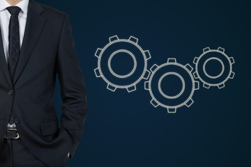 businessman and three cogwheel