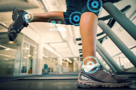 Composite image of fit woman running on the treadmill