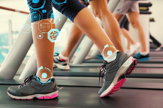 Composite image of row of people working out on treadmills