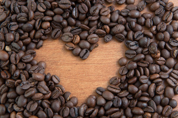 Coffee heart on wooden mat