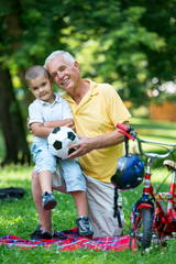 grandfather and child have fun  in park